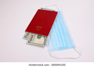 US Dollar Currency Paper Money 100 Hundred Dollar Bill Red Passport Book Face Mask On White Background