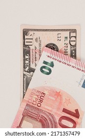 US dollar and Euro banknote money - Shutterstock ID 2171357479