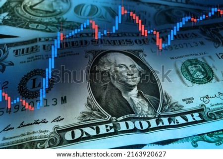 US dollar with a stock market index chart. Dollar rise concept. Economic recovery of the United States of America. US economic and financial recovery.