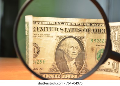 The us dollar through magnifying glass