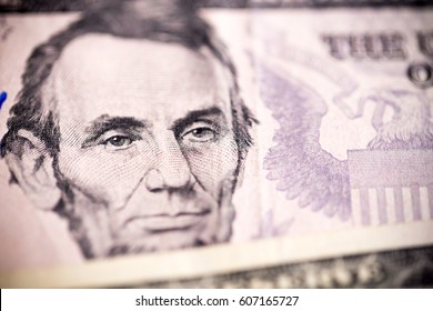 US Dollars $5 Dollar Bill Note With The Face Of President Abraham Lincoln.
