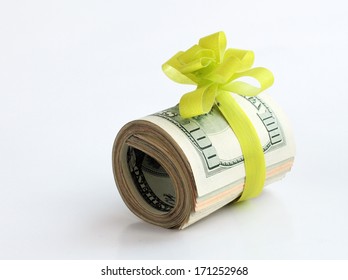 U.S. dollars banknotes with a green ribbon as a gift of money 