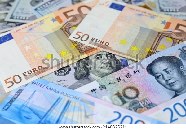 US dollars, Chinese yuan, Euro\
banknotes and Russian rubles. Concept of trade war between the\
China and USA, american and european sanctions against\
Russia