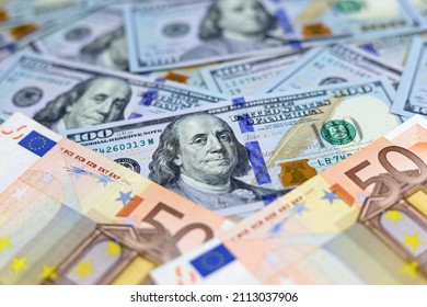 US Dollars And Euro Banknotes. Concept Of Exchange Rate, Investment And Trade Between The United States And European Union