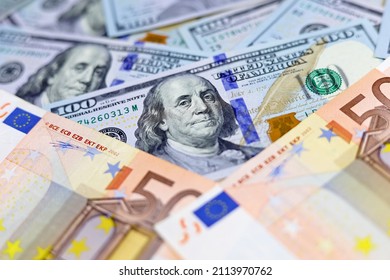 US Dollars And Euro Banknotes. Concept Of Exchange Rate, Investment And Trade Between The United States And European Union