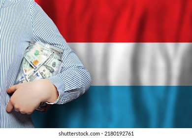 US Dollars Money And Flag Of Luxembourg. Business, Banking And Currency Exchange In Luxembourg