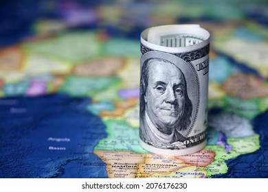 US Dollars On The Africa Map Background. American Investment And Trading, African Economy