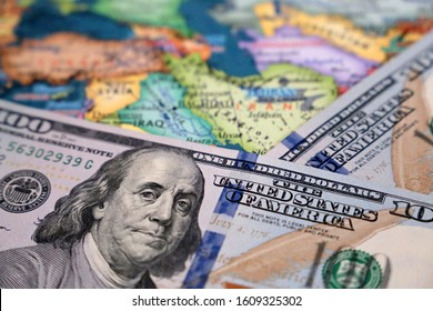 US Dollars On The Map Of Iran And Iraq. Conflict Between Washington And Tehran, Trading In Middle East, Oil Industry