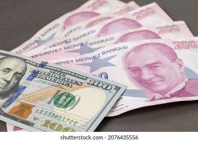 US dollars and Turkish Liras on top of each other completely covering the screen. 1 US dollar being equal to 10 Turkish Liras concept photo shoot 