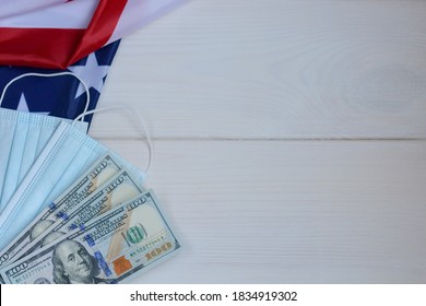 U.S. Economic Crisis Amid Coronavirus Pandemic. US Presidential Election In The Context Of The Coronavirus Pandemic.Medical Mask, Dollars On The American Flag.Copy Space For Text