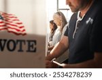 US election day, Senior American woman voting at booth at voting booth at US election station. Us election day. US election day. People vote for American democracy.