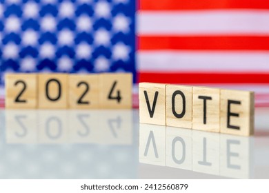US elections 2024, American flag and the word VOTE 2024. The concept of voting in the United States 
