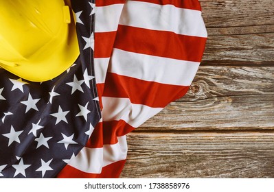 US. federal holiday of Labor Day is United States America of engineer yellow plastic construction helmet, american patriotic background - Powered by Shutterstock