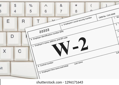 A US Federal Tax W2 Income Tax Form On A Keyboard