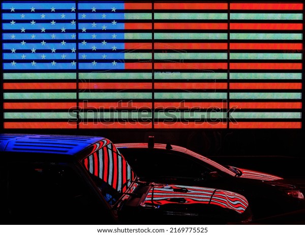US flag and car\
reflections