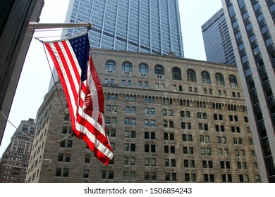 US Flag Flying On The Background Of The Facade Of The Federal Reserve Building In New York - July 12, 2012