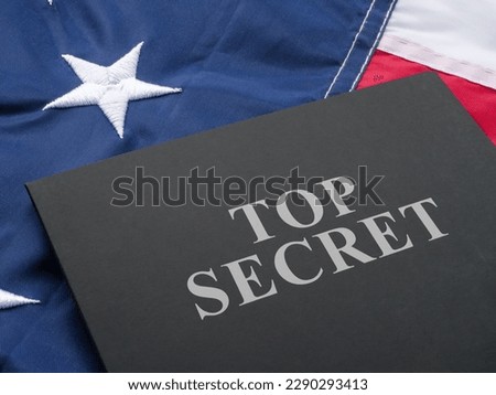US flag and a folder labeled Top Secret.
