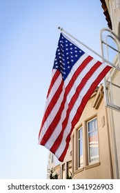 US Flag Hanging From A Window In The Marina District, SF, California.