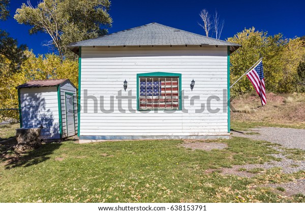 Us Flag Hangs On Old House Stock Photo Edit Now 638153791