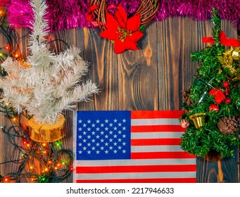 The US Flag On A Christmas Background Made Of Wood.