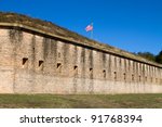 U.S. Flag on top of the ramparts or Fort Barrancas in Pensacola Naval Air Station, Florida.