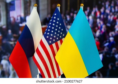 The US flag, Russian flag, Ukraine flag. Flag of USA, Russia, Ukraine. The United States of America and the Russian Federation confrontation. Russia's invasion of Ukraine