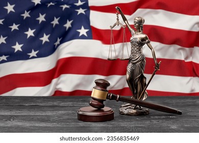 US flag with a statue of justice, judge wooden hammer