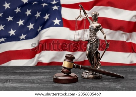 US flag with a statue of justice, judge wooden hammer