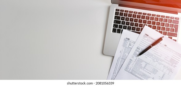 US Individual income tax return. US tax forms on desk. Wide image with copy space - Shutterstock ID 2081056339