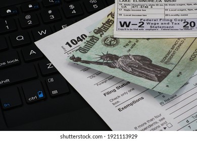 US IRS Internal Revenue Service income tax filing form 1040 with supporting documents. - Shutterstock ID 1921113929