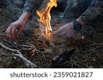 A U.S. Marine with 1st Battalion, 4th Marine Regiment, 1st Marine Division, starts a fire as part of a bilateral cold weather training exercise at Isla Dawson, Chile, Aug. 16, 2023.