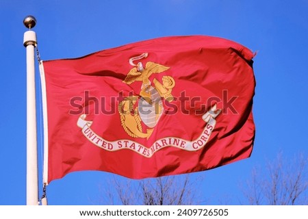 US Marine Corp Flag against a blue sky background