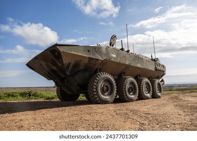 U.S. Marines with Assault Amphibian School ground guide an Amphibious Combat Vehicle during the Basic Land Driving course at Fire Base Gloria at Marine Corps Base Camp Pendleton, California