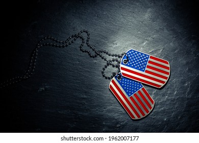 US military dog tags in the shape of the American flag. Memorial Day for Veterans Day concept. - Powered by Shutterstock