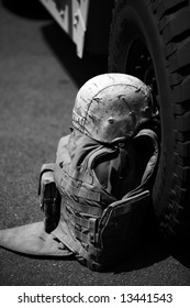 Us Military Flack Jacket And Helmet Lay Against A H1 Humvee