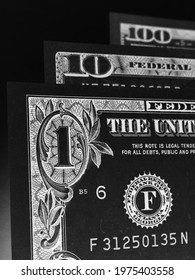 US Money Banknotes Of 1, 10 And 100 Dollars. Dark Vertical Dramatic Illustration About The American Economy, Public Finance And Taxation. Black And White Print That Looks Like An Etching. Macro