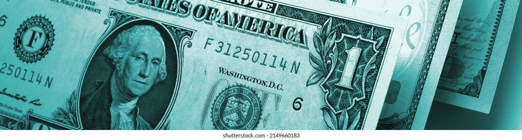 US Money Banknotes Of 1, 10 And 100 Dollars Closeup. Dark Banner Or Headline About The American Dollar Or Economy. Turquoise Tinted Dramatic Header. Public Finance And Taxes. Macro