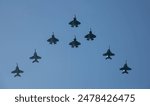 U.S. Navy aircraft perform a formation pass over Nimitz-class aircraft carrier USS George Washington (CVN 73) while underway in the Pacific Ocean, June 19, 2024