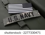 U.S. Navy Branch Tape with national US flag patch on green ammo can background