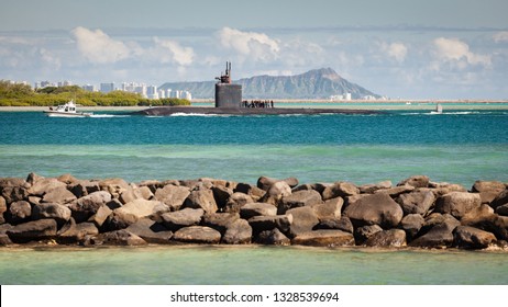 U.S. Navy Fast Attack Submarine Arriving At Pearl Harbor, Oahu, Hawaii, USA With Diamond Head And Downtown Honolulu In The Background.