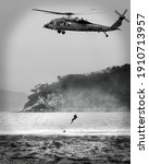 A US Navy MH-60 helicopter with rescue swimmers practices off the coast in Tokyo Bay.