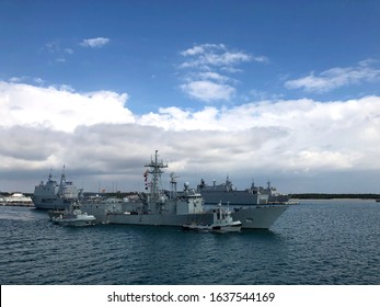 A Us Navy Military Ship Leaving Rota Naval Base For A Deployment