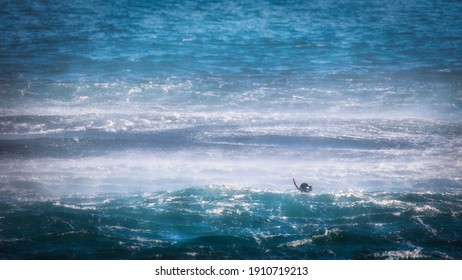 A US Navy Rescue Swimmer In The Spray From His Helicopter After Jumping Out Near Yokosuka, Japan.