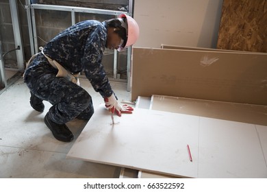 US Navy Sailors Based In Norfolk, VA Help Habitat For Humanity NYC On A Home Building Construction Project In The Brownsville Section Of Brooklyn During Fleet Week New York, NEW YORK MAY 25 2017.