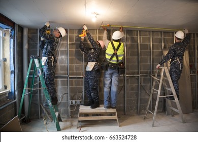 US Navy Sailors Based In Norfolk, VA Help Habitat For Humanity NYC On A Home Building Construction Project In The Brownsville Section Of Brooklyn During Fleet Week New York, NEW YORK MAY 25 2017.