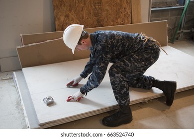 US Navy Sailors Based In Norfolk, VA Help Habitat For Humanity NYC On A Home Building Construction Project In The Brownsville Section Of Brooklyn During Fleet Week New York, NEW YORK MAY 25 2017.