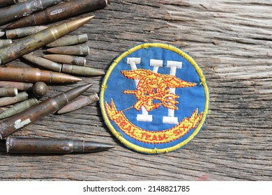 US NAVY SEAL TEAM SIX, Military Patch US Army Military Ammunition Bulet On Wood Background - Image