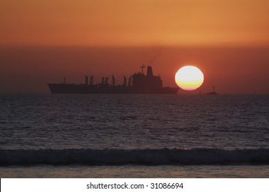 A US Navy Underway Replenishment (refueling) Ship Off The Coast Of Coronado, CA At Sunset (http://www.artistovision.com/military/navy-supply-ship.html).