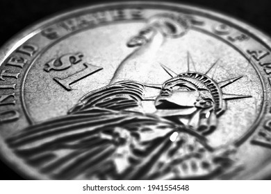 US One Dollar Coin Close-up. Dark Dramatic Black And White Illustration About American Money, Economy, Finance And Debt Market. State Benefits And Government Assistance. Helicopter Money. Macro