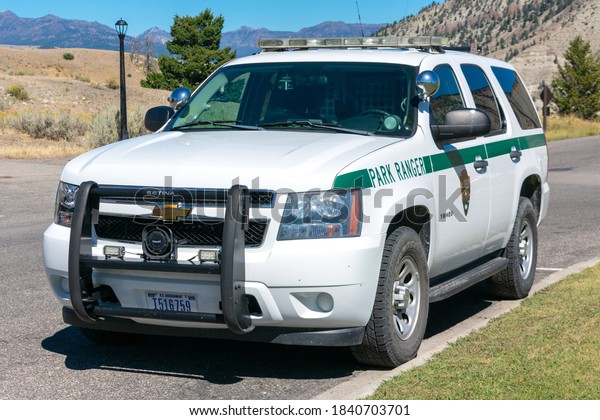 US Park Ranger\
vehicle of National Park Service parked outdoor - Mammoth,\
Yellowstone National Park -\
2020